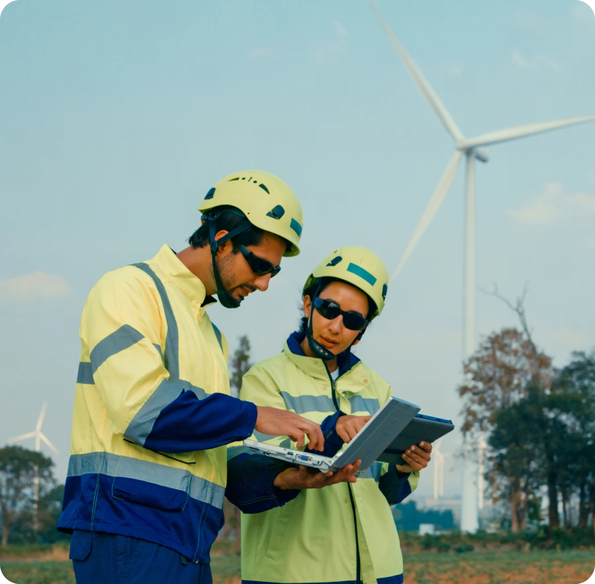 Renewable energy technicians with laptops
