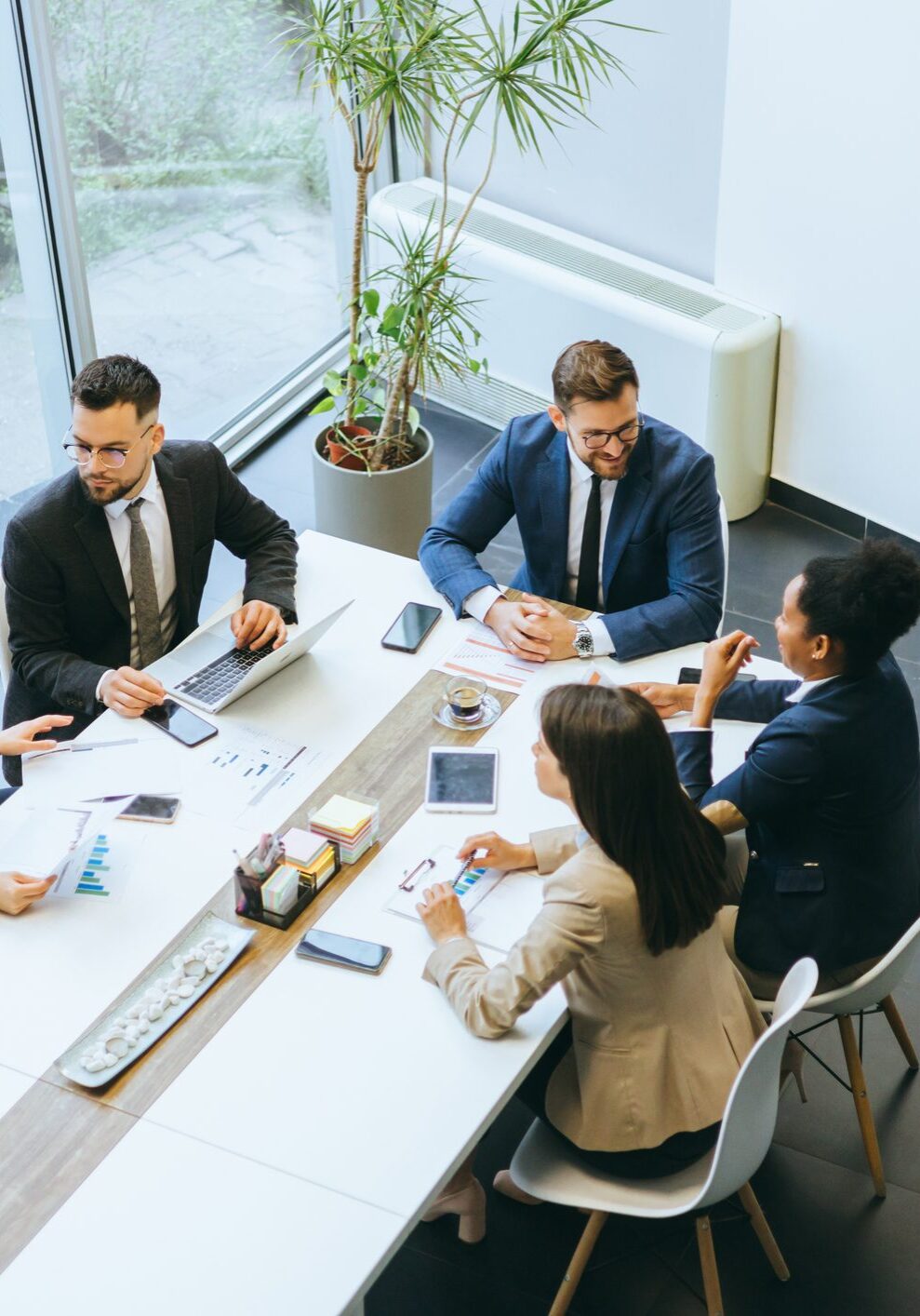 Business colleagues collaborate on a project at a conference table in a modern office